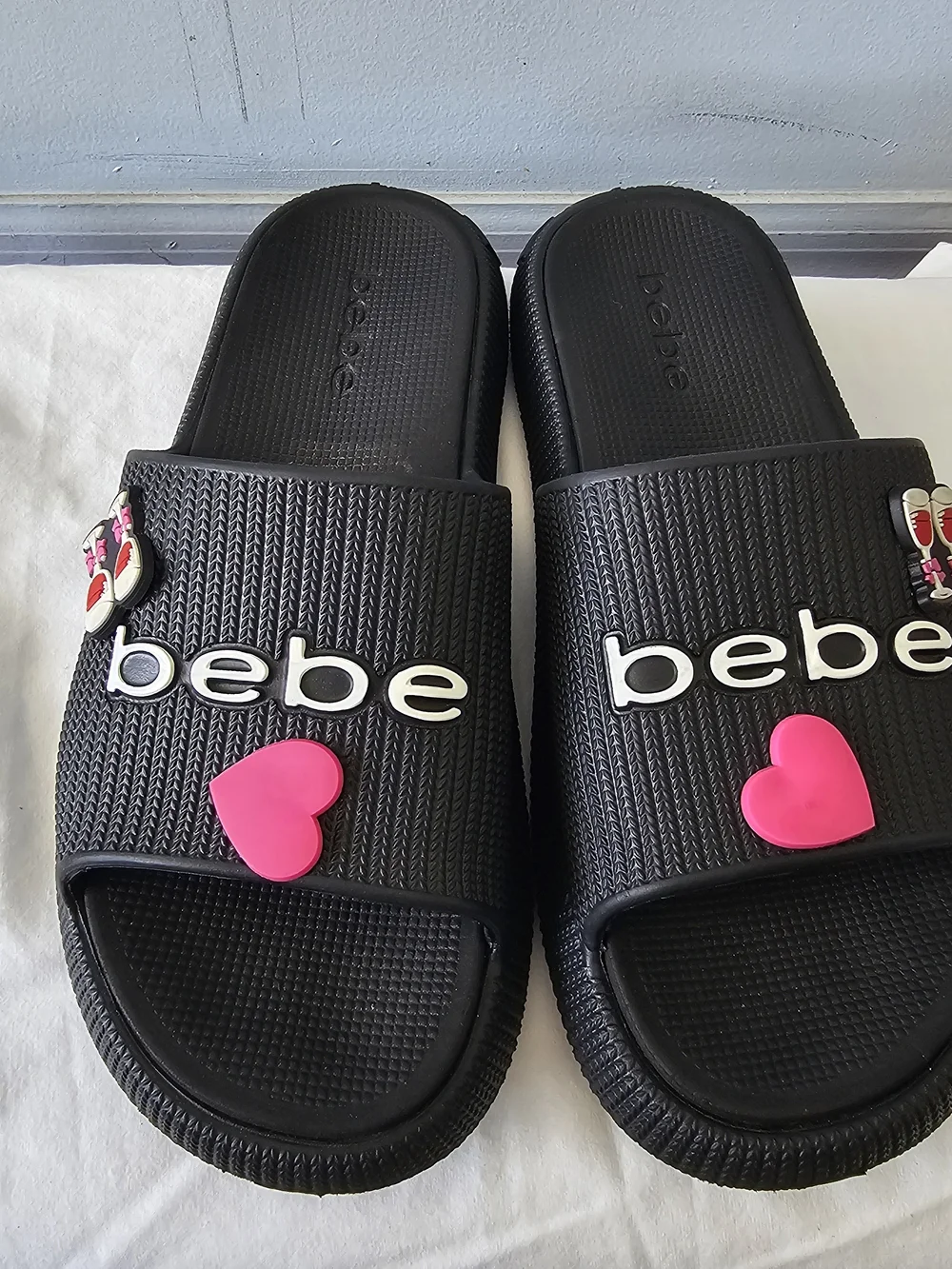 bebe Black Slide Sandals with Pink Heart Accent